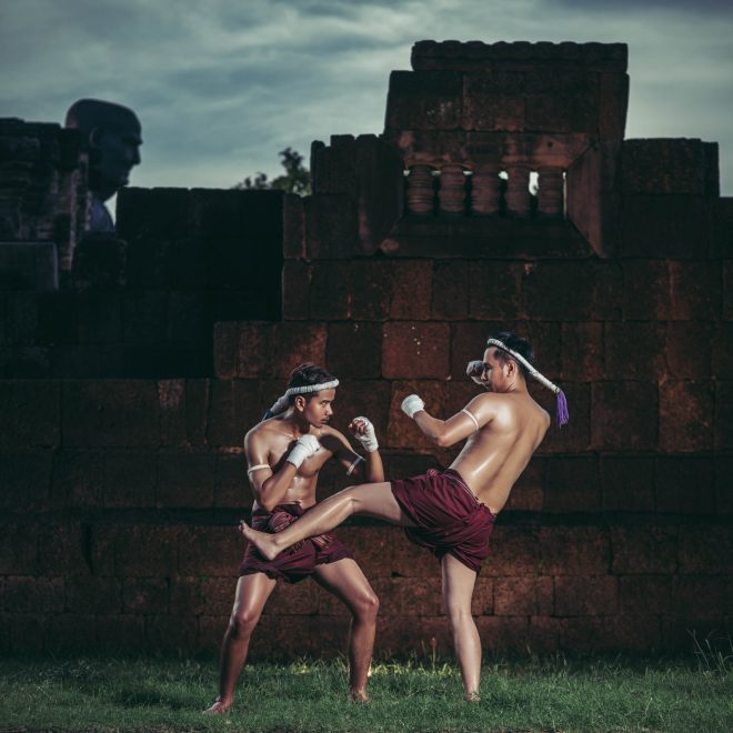 Two boxers fight with the martial arts of Muay Thai. Selective focus.